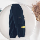 Monos de bolsillo grandes para niños de nuevo estilo de otoño e invierno, pantalones casuales de algodón para niños a la moda